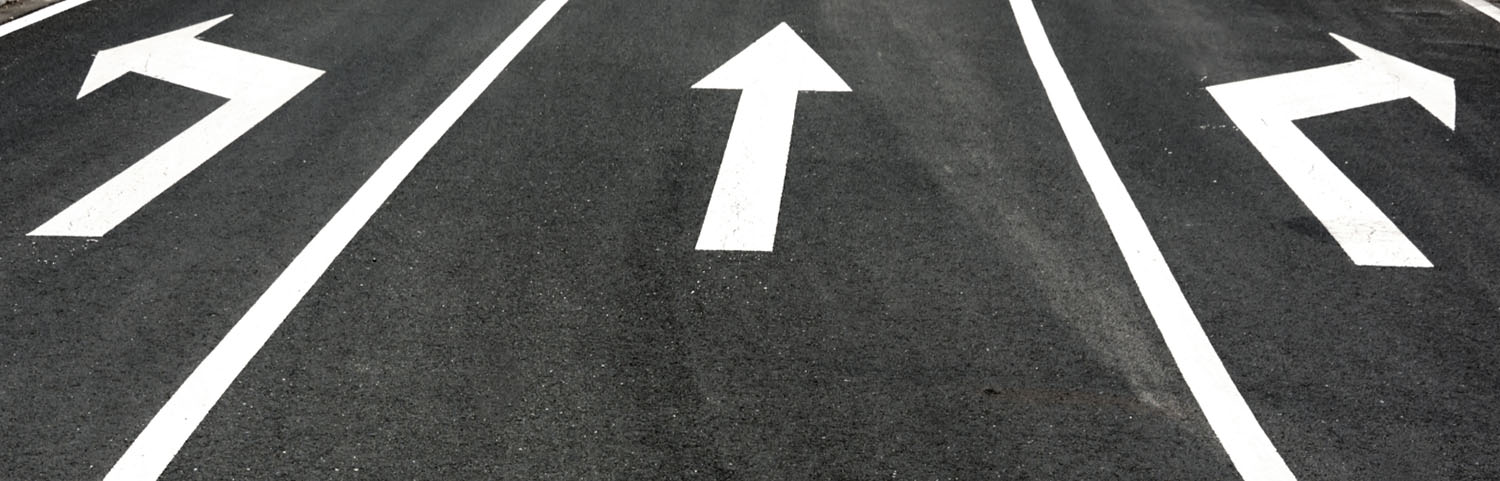 Road markings pointing to different directions