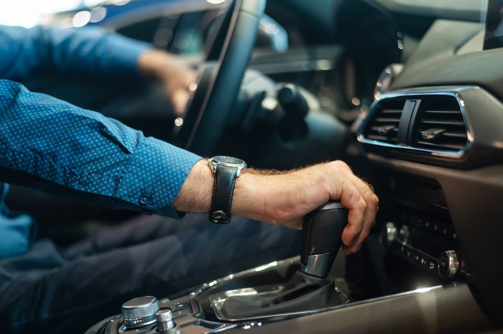 Man driving a manual car