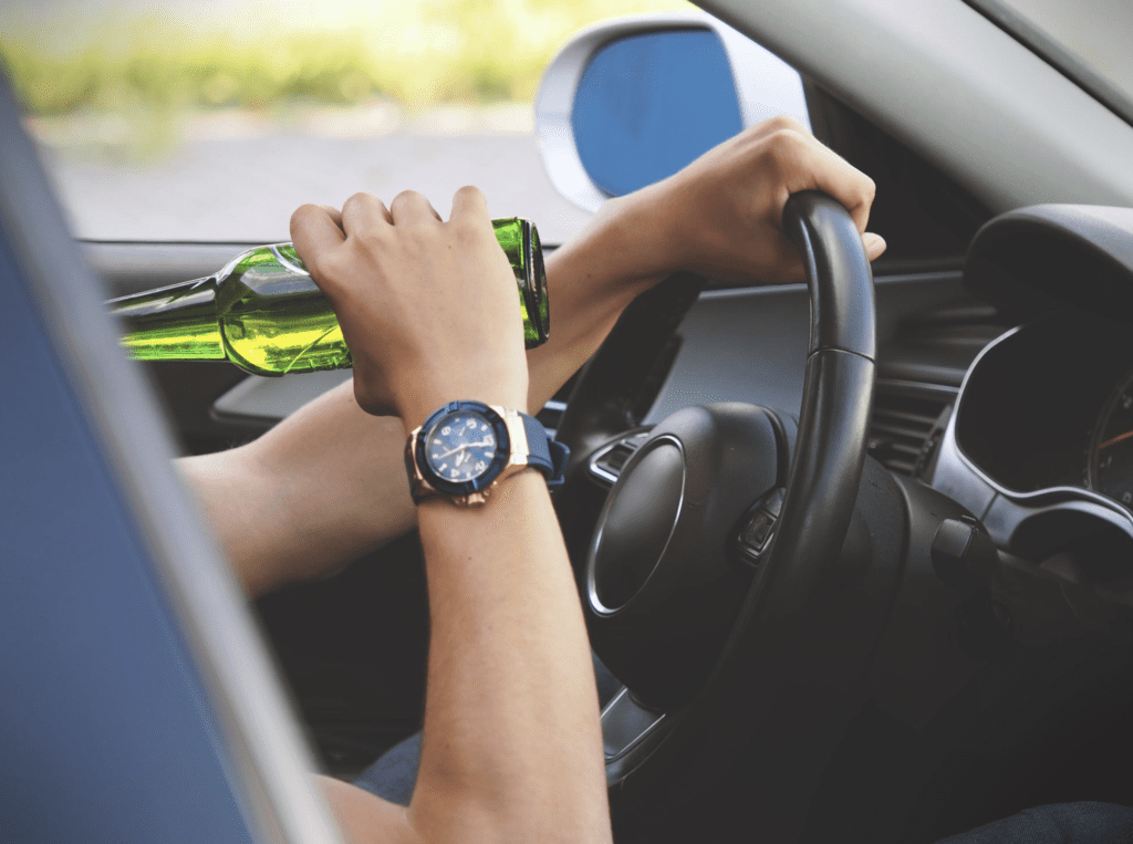 Man Driving with a Beer