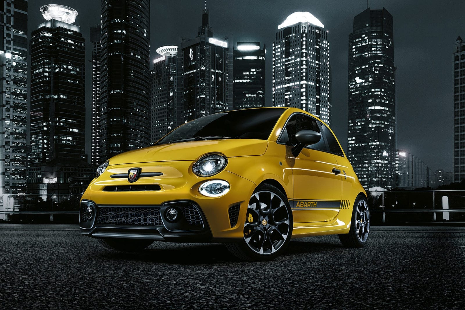 Yellow Abarth in Night sky Backdrop Yellow Abarth