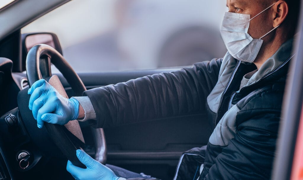 man doing contact-free car delivery