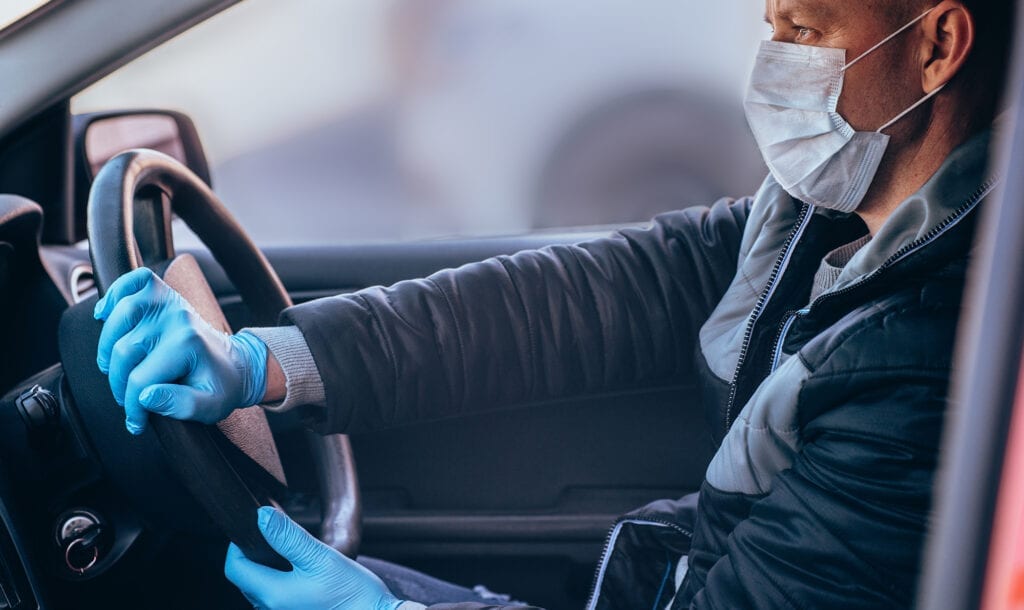 man doing contact-free car delivery