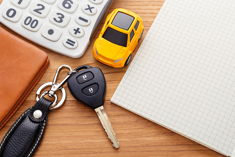 Car keys and wallet on table