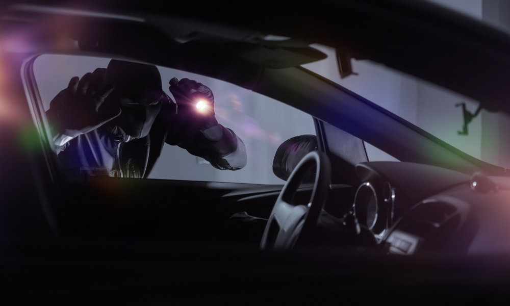 car thief looking in window at night
