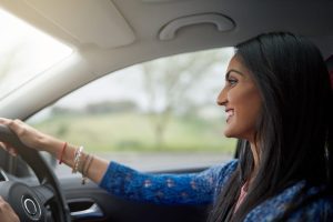 young woman driving car