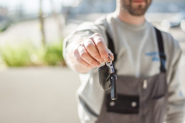 mechanic holding keys Mechanic keys